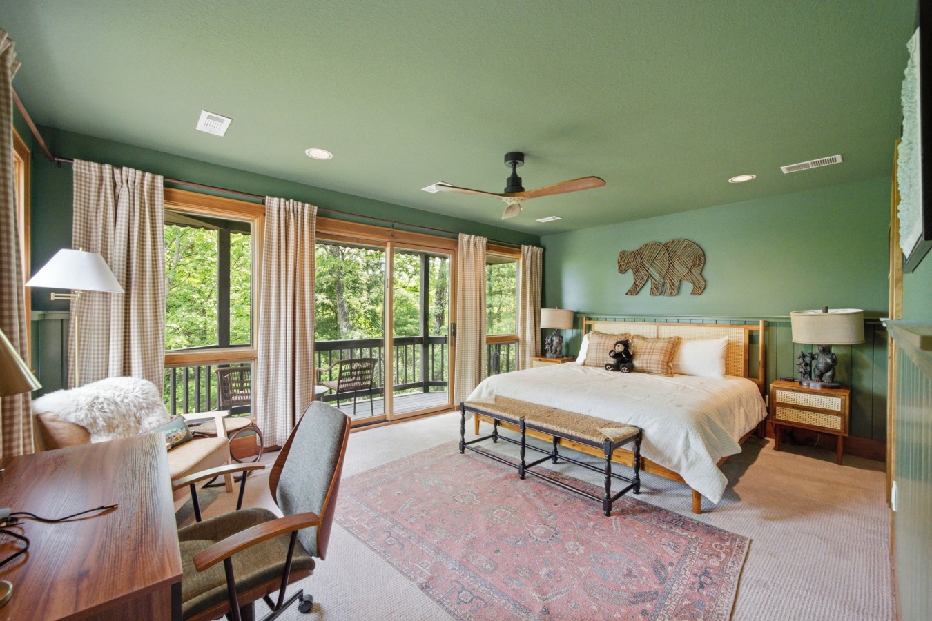 Upper-level king bedroom with a mountain view
